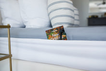 Load image into Gallery viewer, The Better Bedder is like a giant headband that wraps around your mattress. Once on, it also creates a pocket on the sides doubling as a nightstand. You can store your books, glasses, remote, etc. in your Better Bedder. How to keep sheets on your mattress? The Better Bedder is the answer. This helps keeps sheets on adjustable beds, helps keep sheets on tempurpedic mattresses, and more. It is the latest and best solution for keeping your fitted sheets on your mattress!