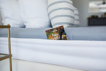 Load image into Gallery viewer, The Better Bedder is like a giant headband that wraps around your mattress. Once on, it also creates a pocket on the sides doubling as a nightstand. You can store your books, glasses, remote, etc. in your Better Bedder. How to keep sheets on your mattress? The Better Bedder is the answer. This helps keeps sheets on adjustable beds, helps keep sheets on tempurpedic mattresses, and more. It is the latest and best solution for keeping your fitted sheets on your mattress!