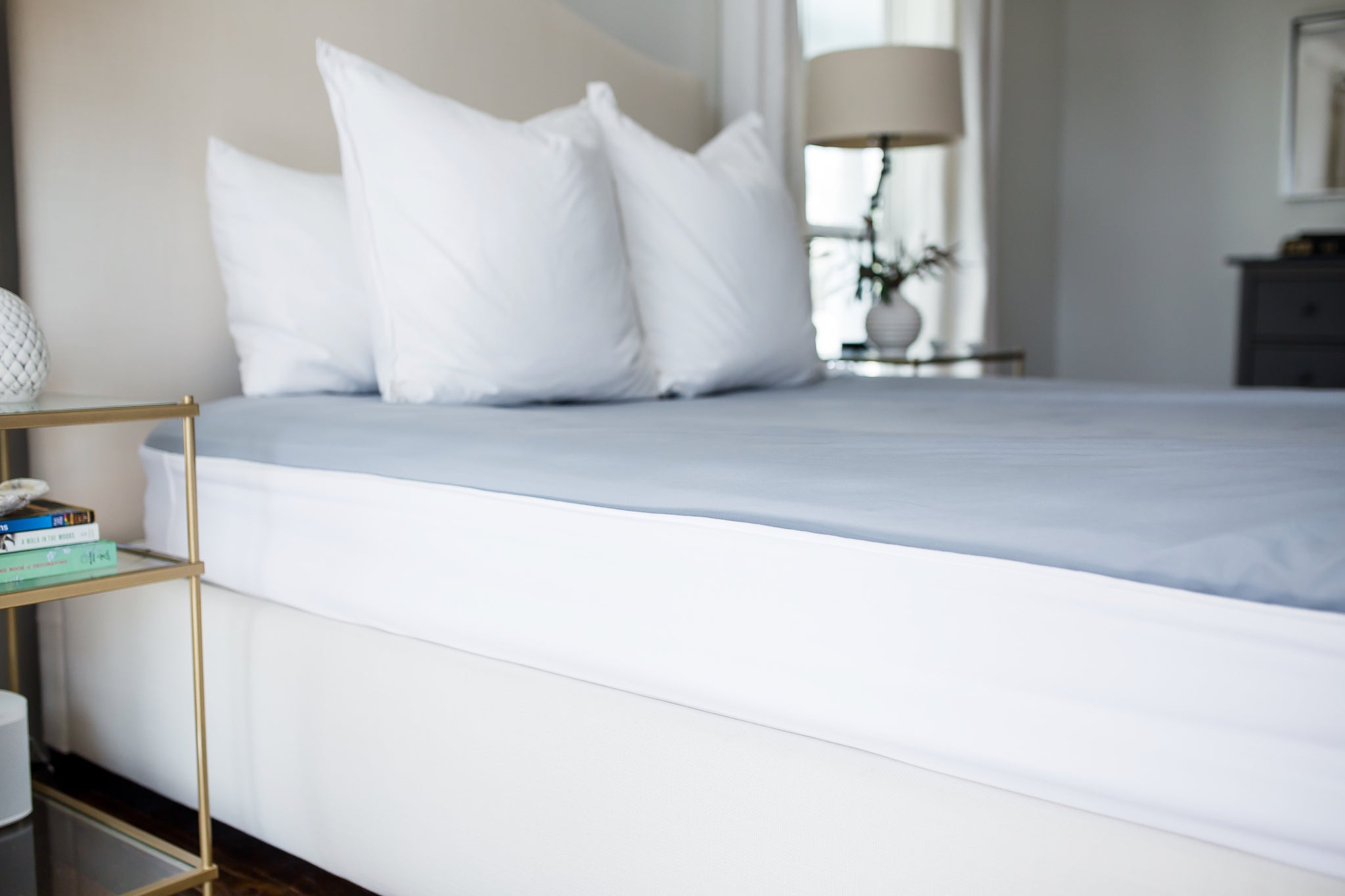Putting the Better Bedder® on your mattress. No more tucking sheets under  your heavy mattress! 